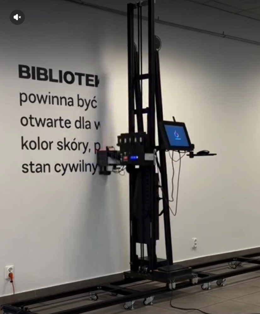 Direct-to-wall printer applying typography to an office wall